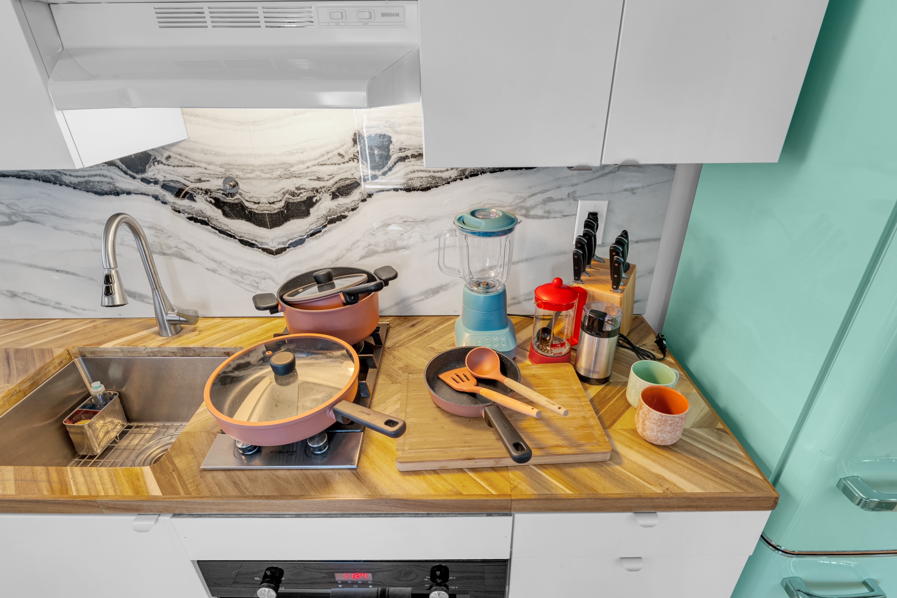 The Beach House — kitchen stocked with cookware and coffee