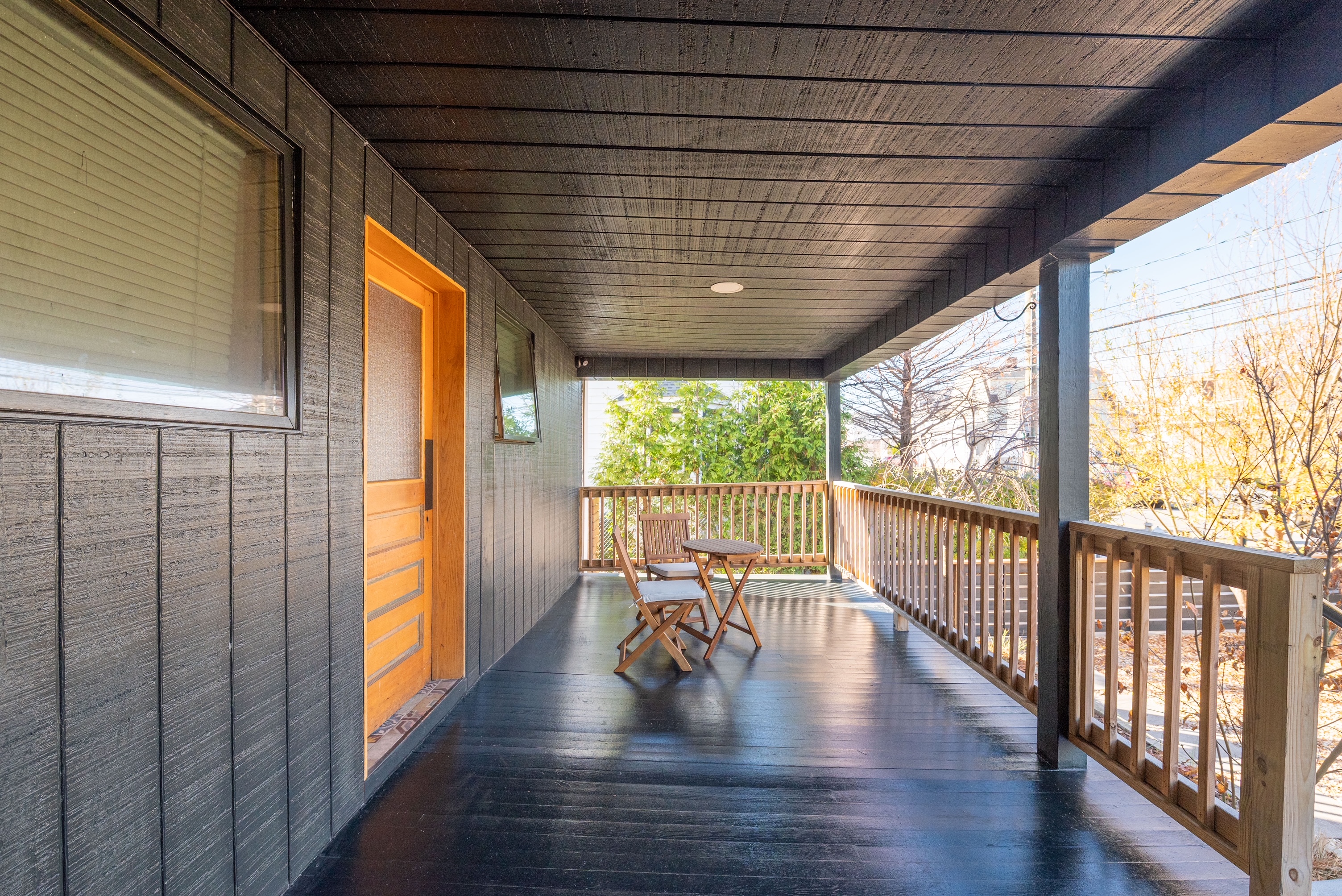 Shared covered porch with bistro seating