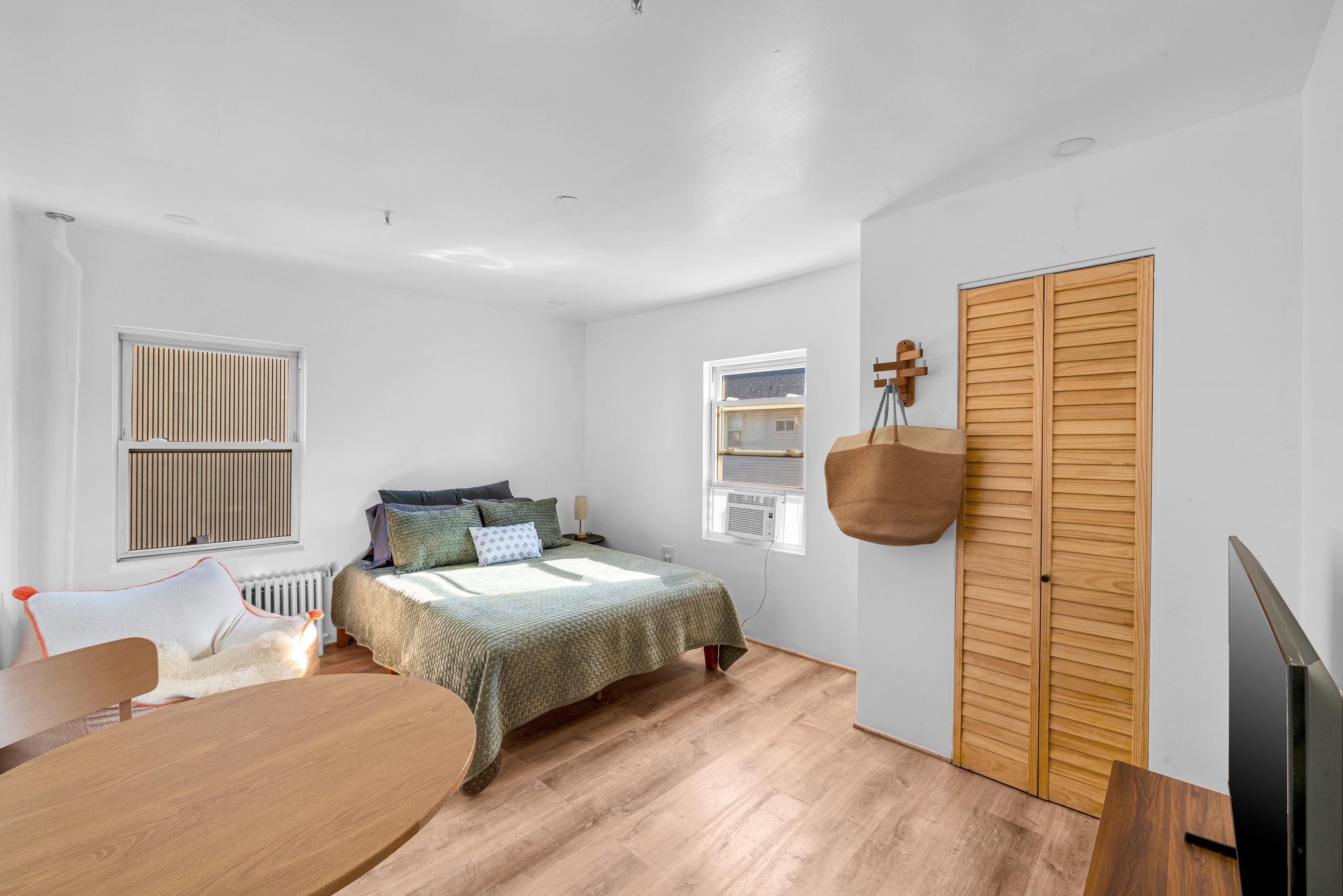 The Surf Studio — sunlit sleeping area with queen bed