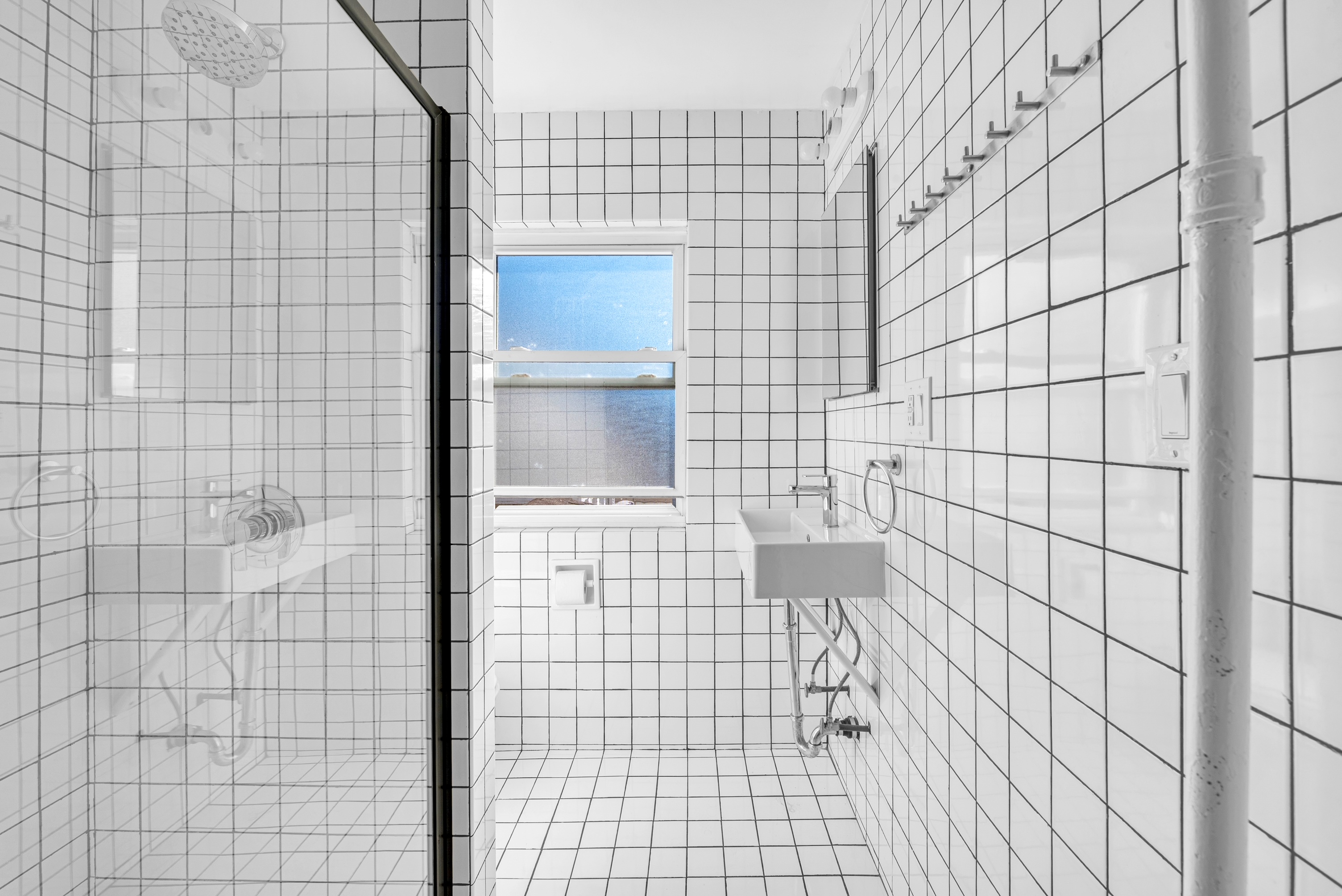 The Surf Studio — bright tiled bathroom with shower
